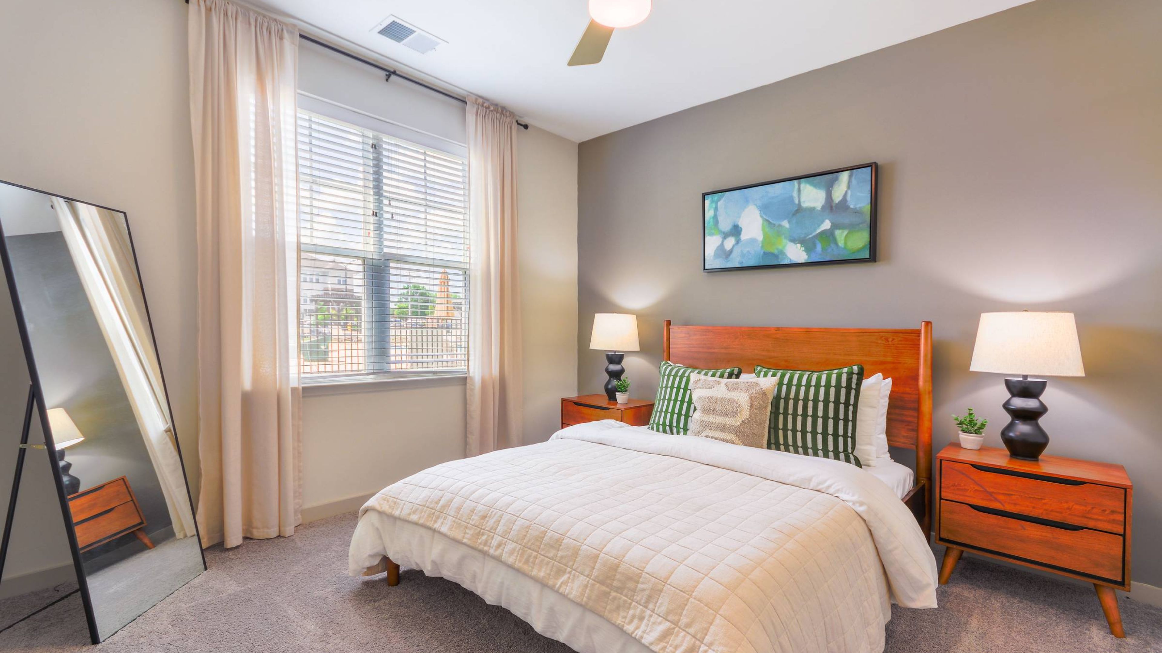 Hawthorne at St. Marks cozy bedroom, featuring a wooden bed frame and modern decor.
